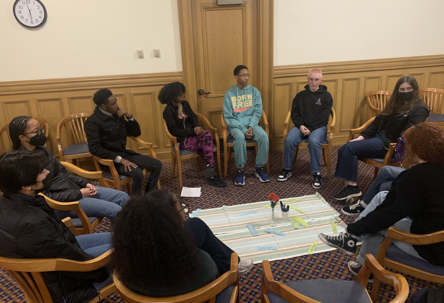 Youth Commissioners hosting a healing circle within the Youth Commission in-person at a subcommittee meeting