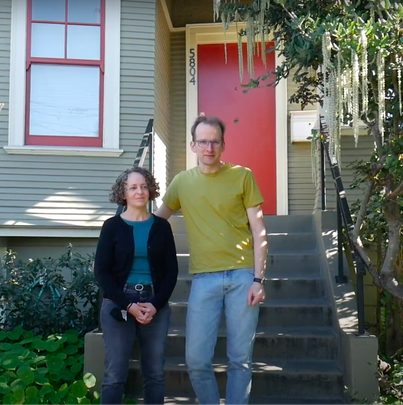 Dan and Tamara in front of house